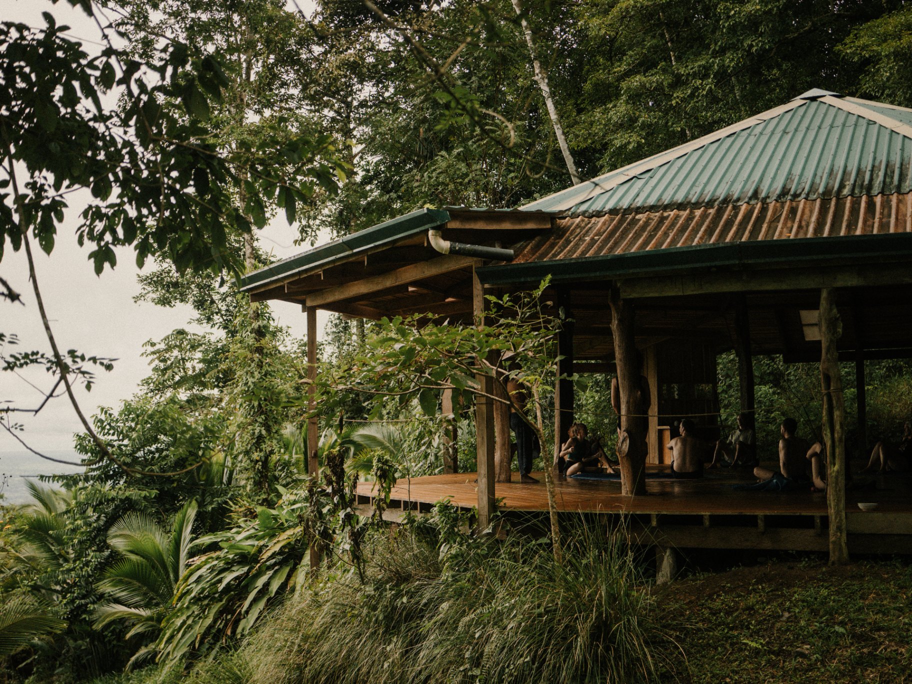 Wooden open sided building in the jungle at Protopia Community, regenerative farm coliving in Costa Rica